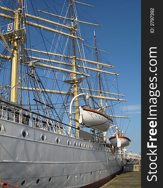 Big and old sailing ship in a harbour of Gdynia, Poland. Big Mast and life boats. Big and old sailing ship in a harbour of Gdynia, Poland. Big Mast and life boats.