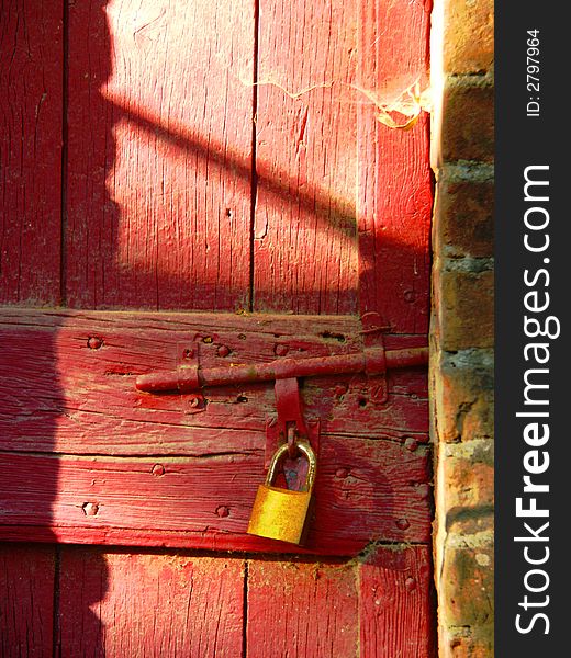 Padlock on an old red door. Padlock on an old red door