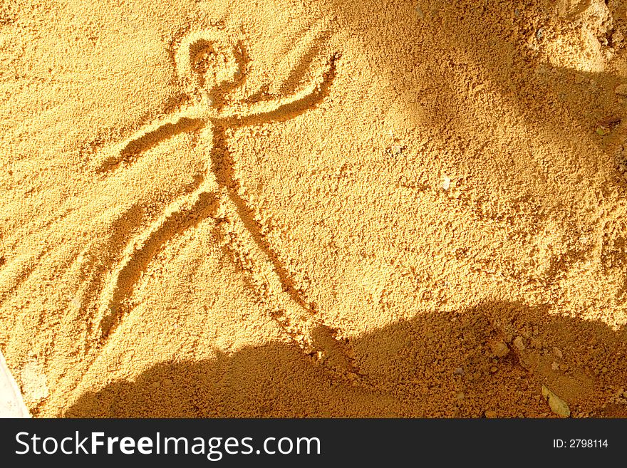 Sand guy : drawing of a person in the sand. Sand guy : drawing of a person in the sand