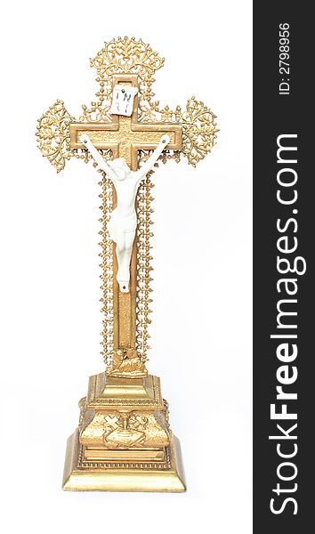 Golden crucifix on the white background