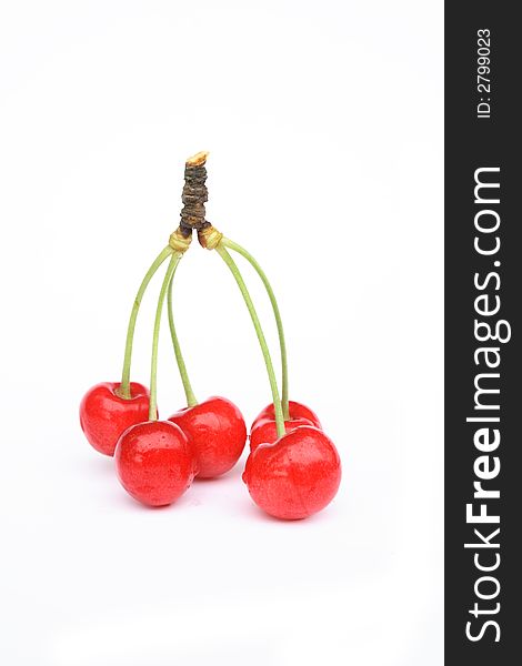 Fresh red cherries on the white background