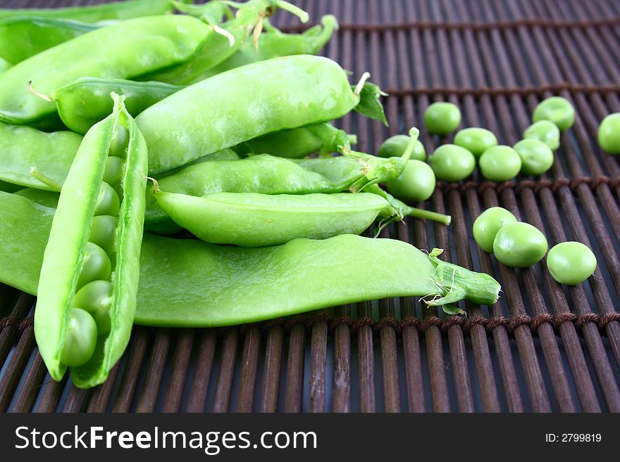 Close-up of green pea pods with depth of field