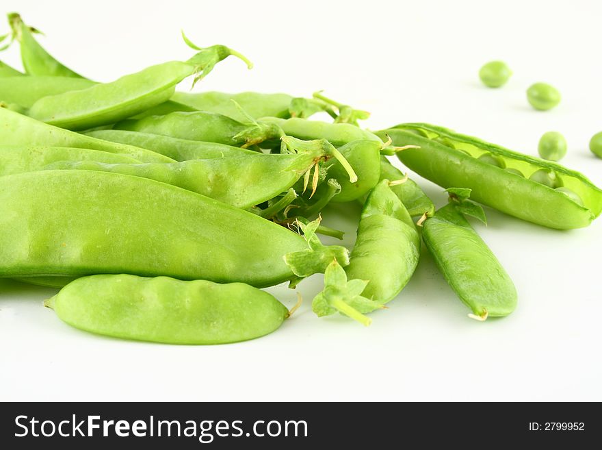 Close-up of green pea pods with depth of field