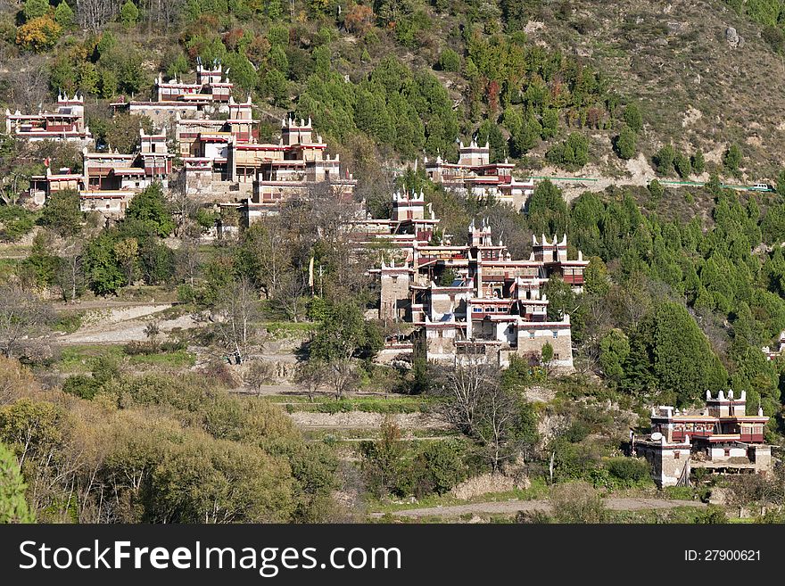 A tibetan village located on a mountain slope. A tibetan village located on a mountain slope