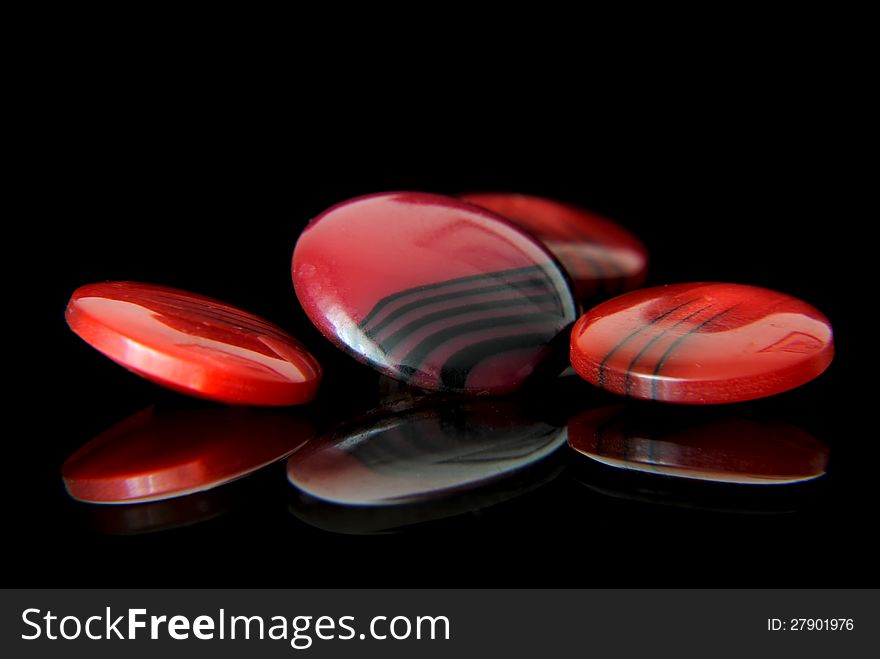 Red buttons on black background