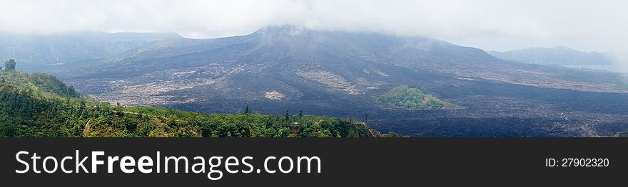 Panorama view of a mountainscape with low clouds. Panorama view of a mountainscape with low clouds