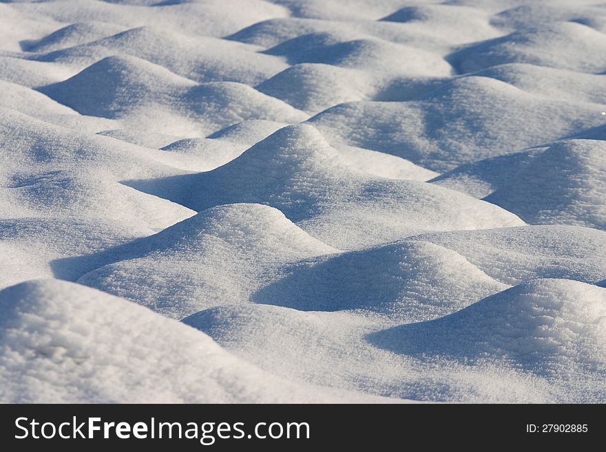 Dunes Of Snow In A Country Field