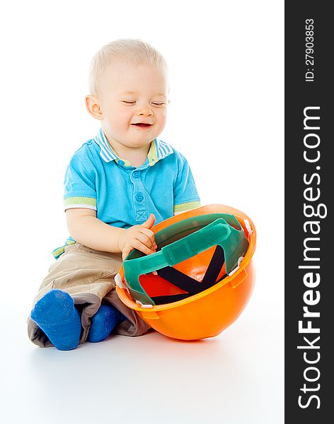 Beautiful happy child and construction helmet. Beautiful happy child and construction helmet