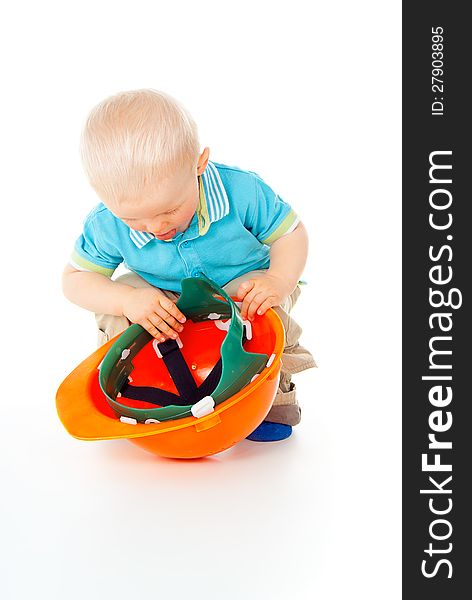 Little child plays with a helmet. Little child plays with a helmet