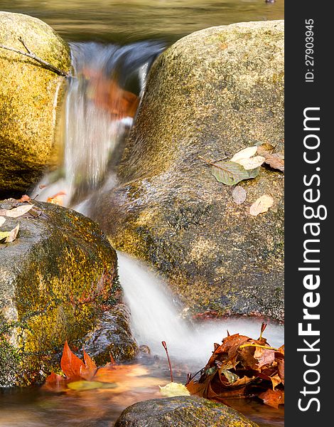 Beautiful veil cascading waterfall, mossy rocks