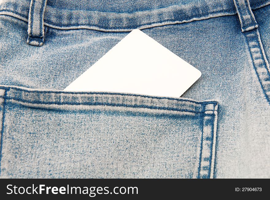 The business card form in a pocket of jeans
