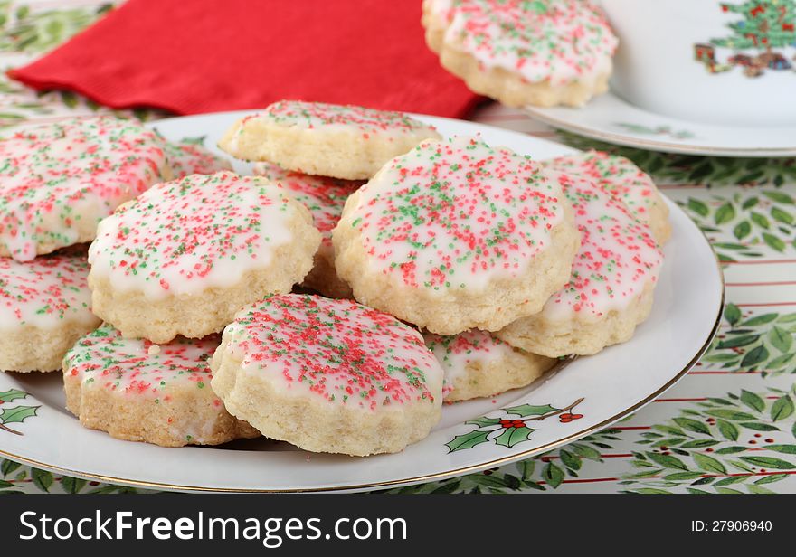 Plate of shortbread cookies withicing and sprinkles