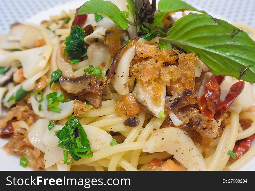 Asian style crisp fish spaghetti with dried garlic chili and green vegetable