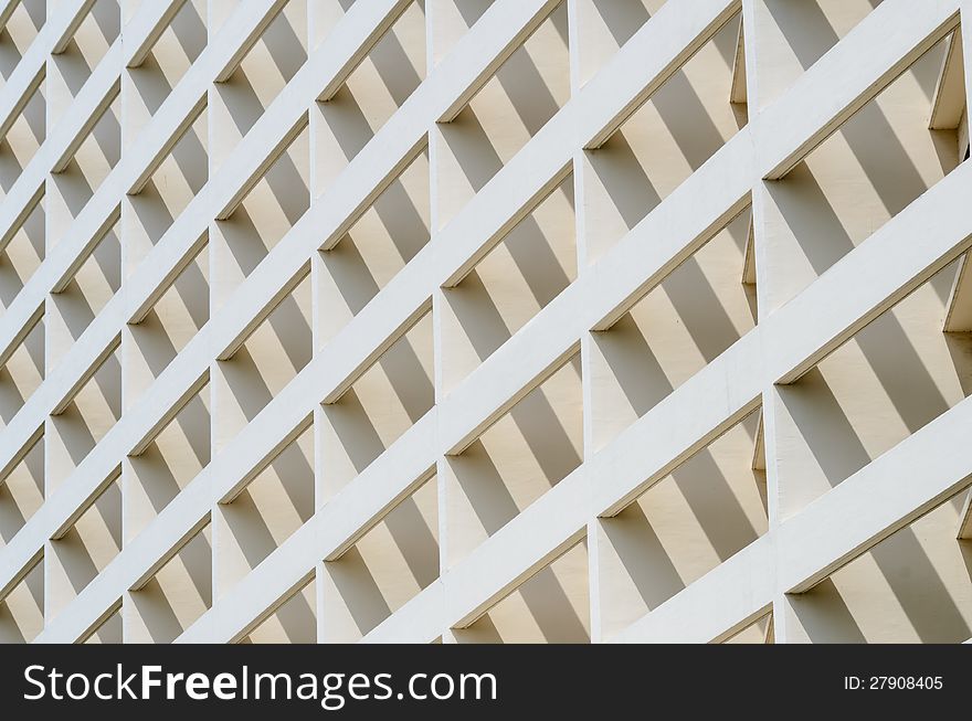 Building facade in angle view with strong light and shadow. Building facade in angle view with strong light and shadow