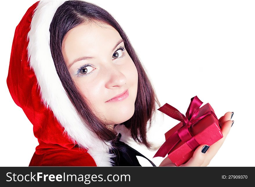 Pretty girl with a gift in Christmas isolated white background