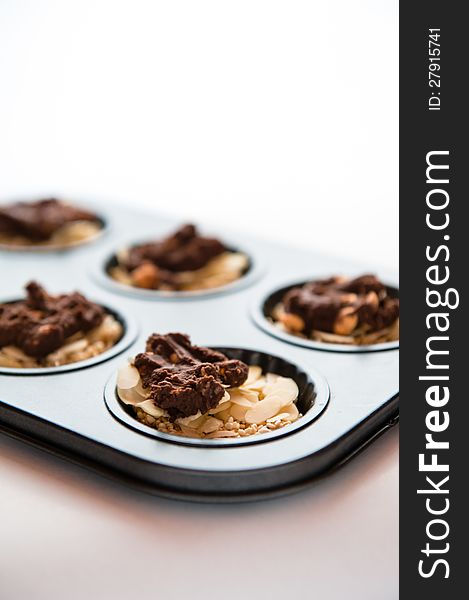 Tray of cookies with chocolate on top on the white background