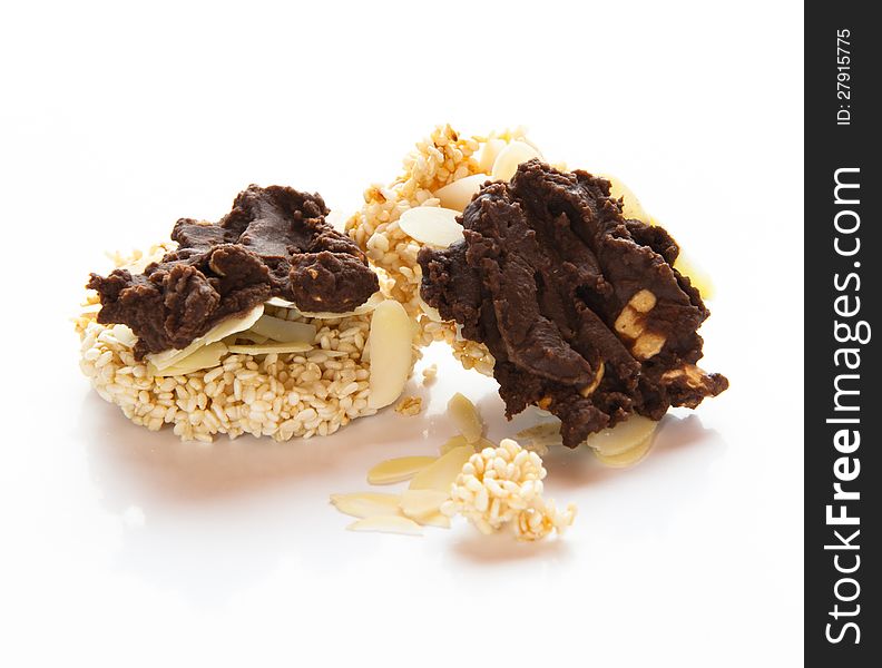 Cookies with chocolate on top an a white background