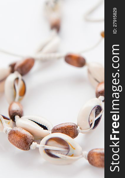 Sea bean necklace on a white background