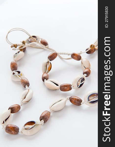 Sea bean necklace on a white background