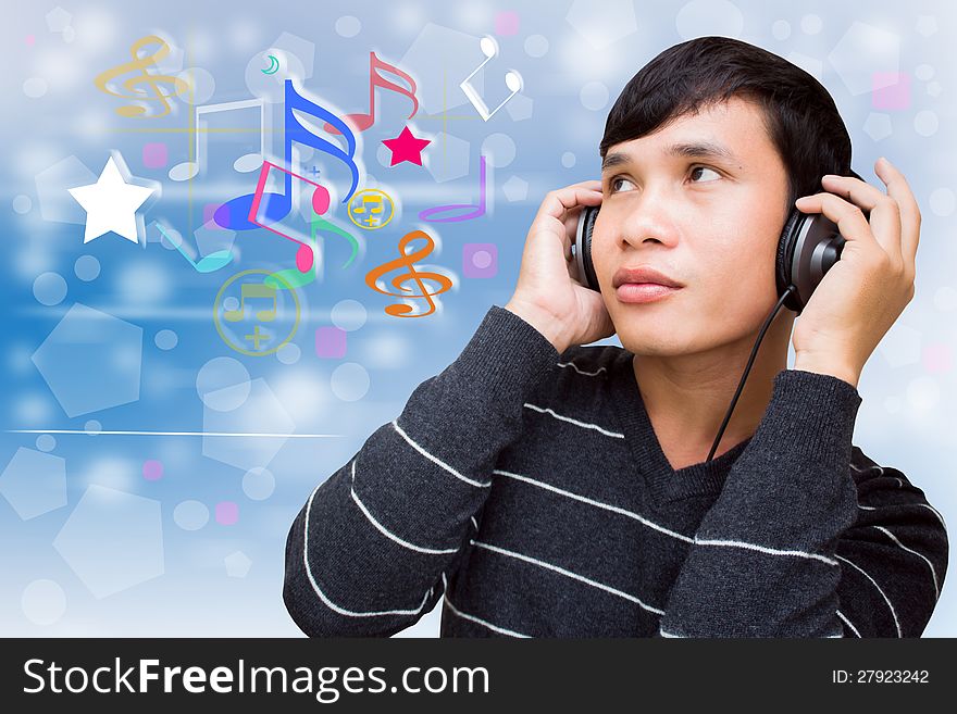 Portrait Of Young Asian Man Listening To Music