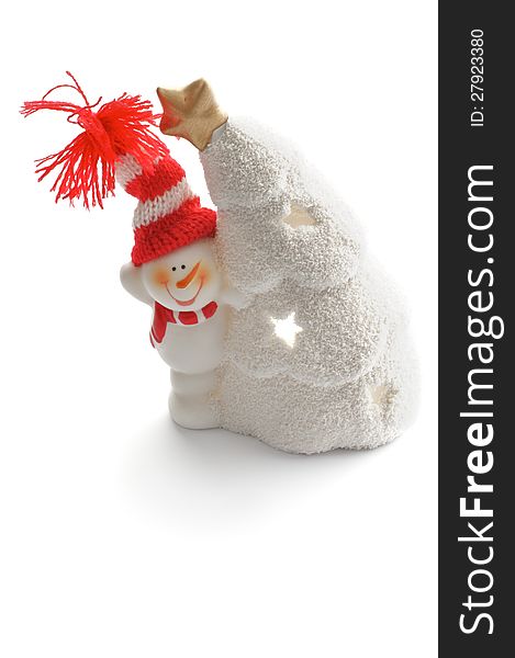 Snowman in Knitted Hat and Snow House as Christmas Decoration closeup on white background