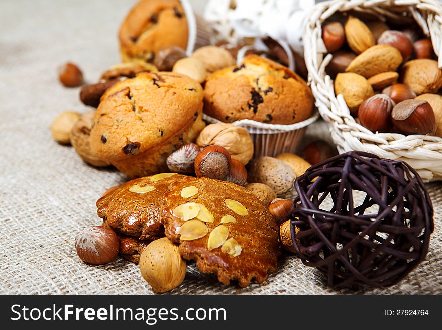 Fresh homemade pastry and nuts over coarse fabric