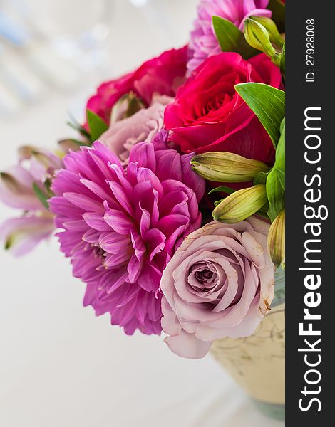 The different colours of cloe-up flowers in a pot.