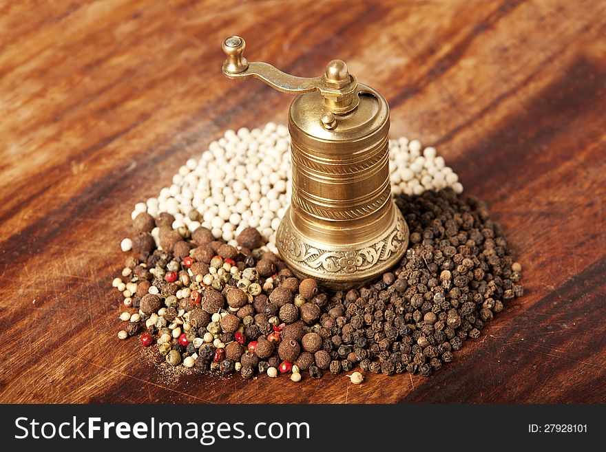 Various types of pepper with hand mill