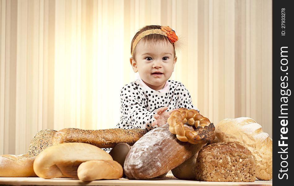 White infant choosing bread in studio. White infant choosing bread in studio
