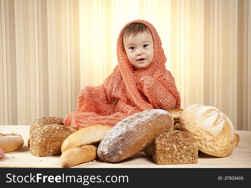 White infant choosing bread in studio. White infant choosing bread in studio