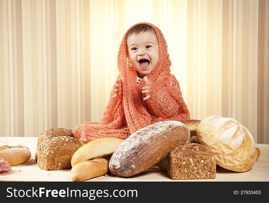 White infant choosing bread in studio. White infant choosing bread in studio