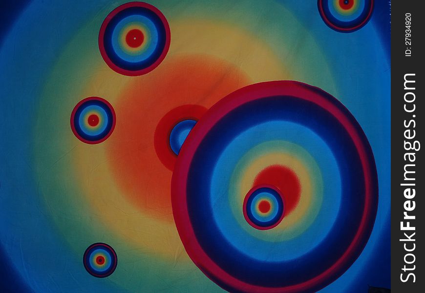 Concentric psychedelic circles on a piece of cloth. Concentric psychedelic circles on a piece of cloth.