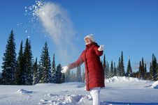 Girl Throws Snow Up In A Sunny Afternoon. Royalty Free Stock Photo Girl Throws Snow Up In A Sunny Afternoon. Royalty Free Stock Photo