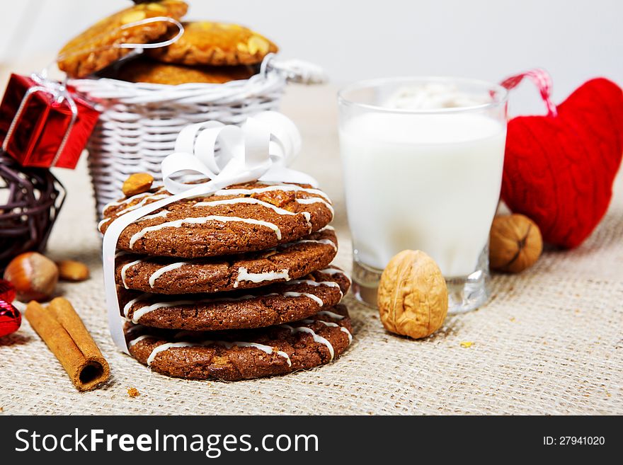 Cookies, nuts, milk and red decoration