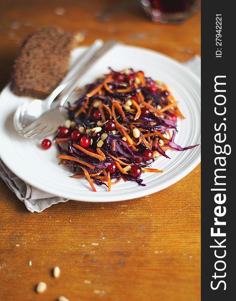 Salad with red cabbage, carrots and cranberry