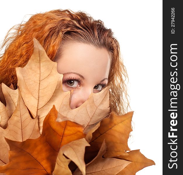 Redhead girl with dry autumn leaves. Redhead girl with dry autumn leaves