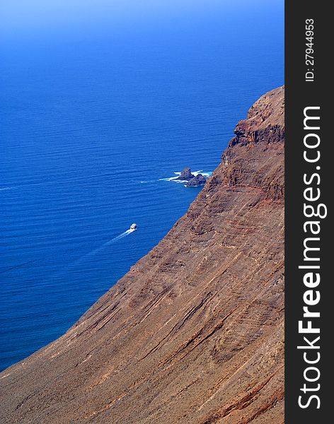 View on a cliff and ocean with boat. View on a cliff and ocean with boat