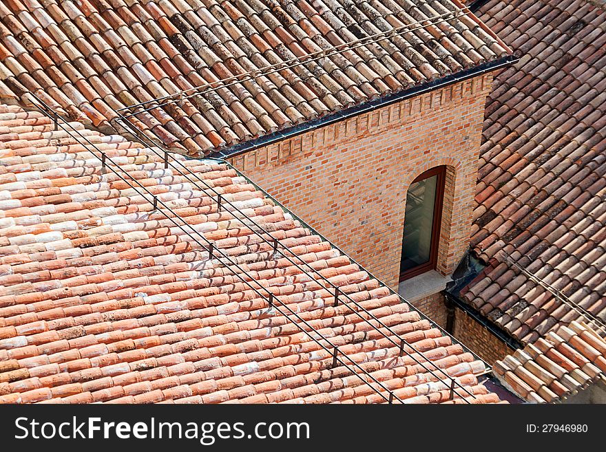 Window in the red tiled roof. Window in the red tiled roof