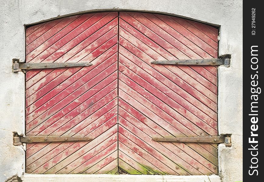 Wooden door with forged curtain