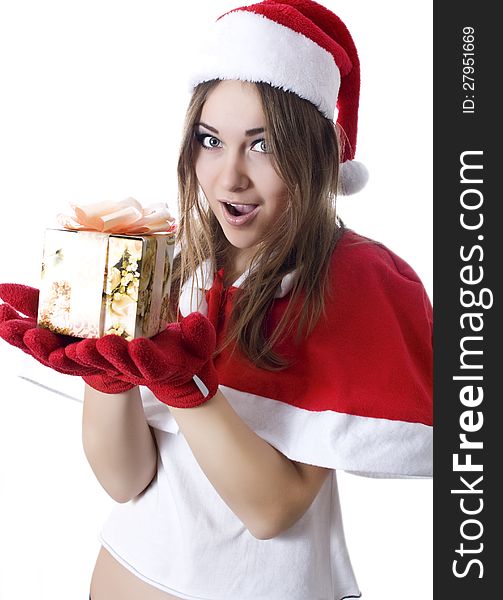 Standing indoors and holding christmas gift. Standing indoors and holding christmas gift