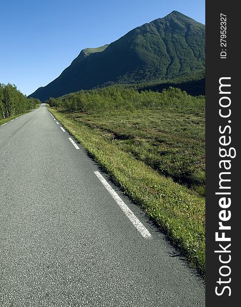 Countryside highway with landforms and sky in outdoor scene. Countryside highway with landforms and sky in outdoor scene