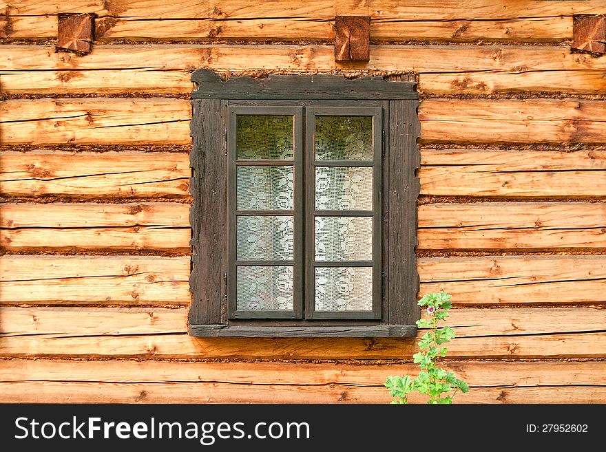 Window of a old wooden cottage. Retro style.