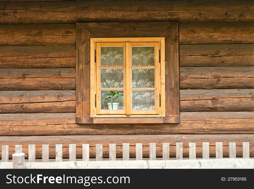 Window of a old wooden cottage. Retro style.