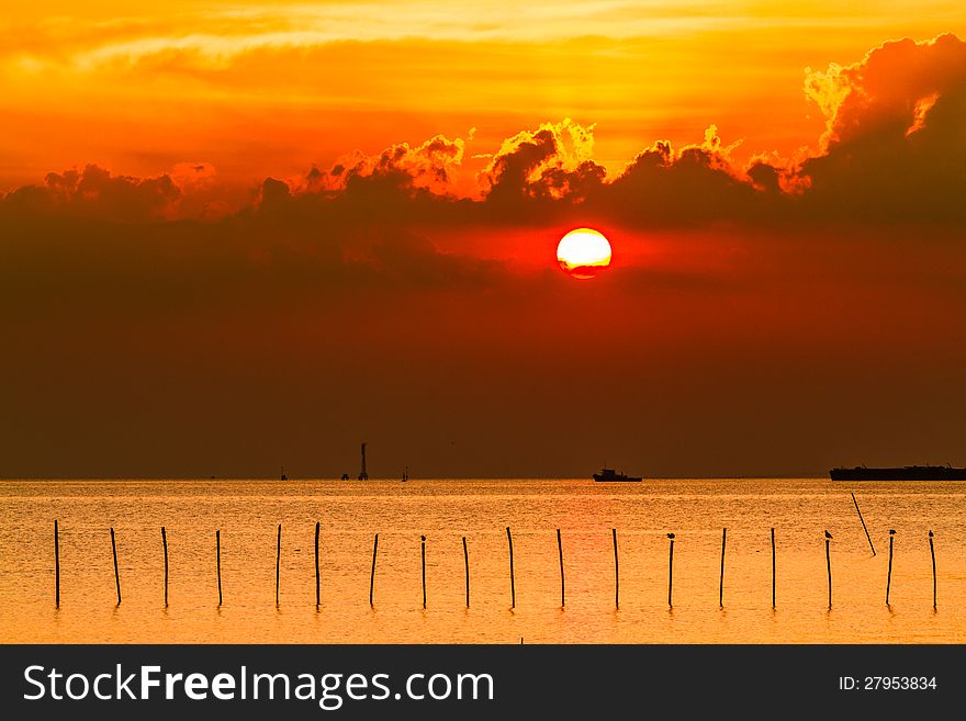 Sea sunset with boat transports