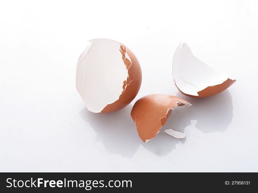 Broken chicken egg on white background. Broken chicken egg on white background