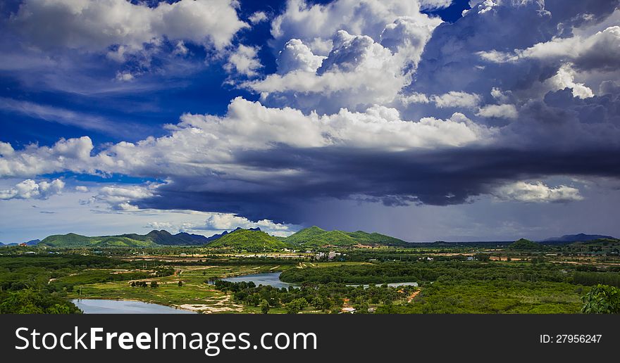 Landscape of pranburi river with dark grey clouds