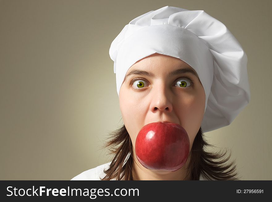 Crazy chef with an apple