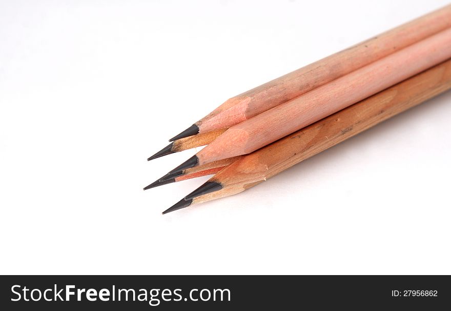 Plain wooden pencil,  on white background. Plain wooden pencil,  on white background