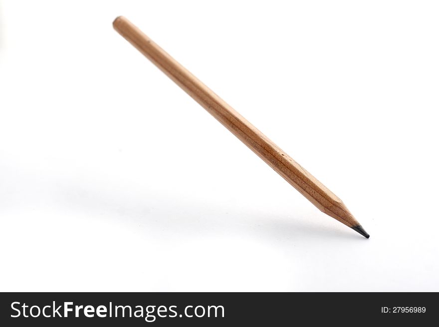 Plain, flying wooden pencil on white background, with soft shadow. Plain, flying wooden pencil on white background, with soft shadow