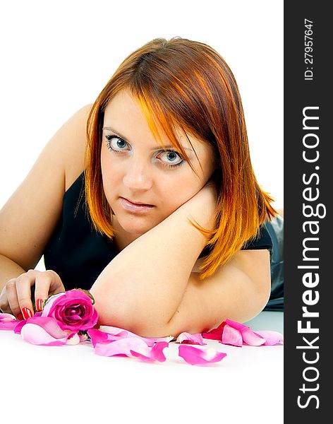 Redhead girl with rose petals. Redhead girl with rose petals